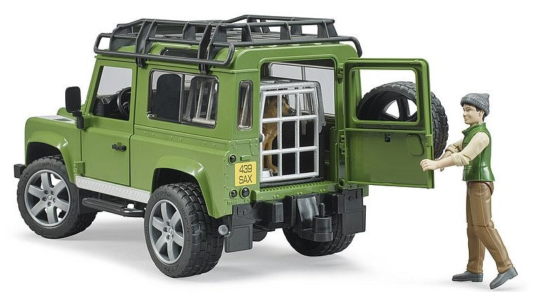 Land Rover Defender Station Wagon mit Förster und Hund