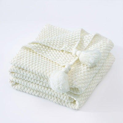 Nordische Strickdecke mit Quasten