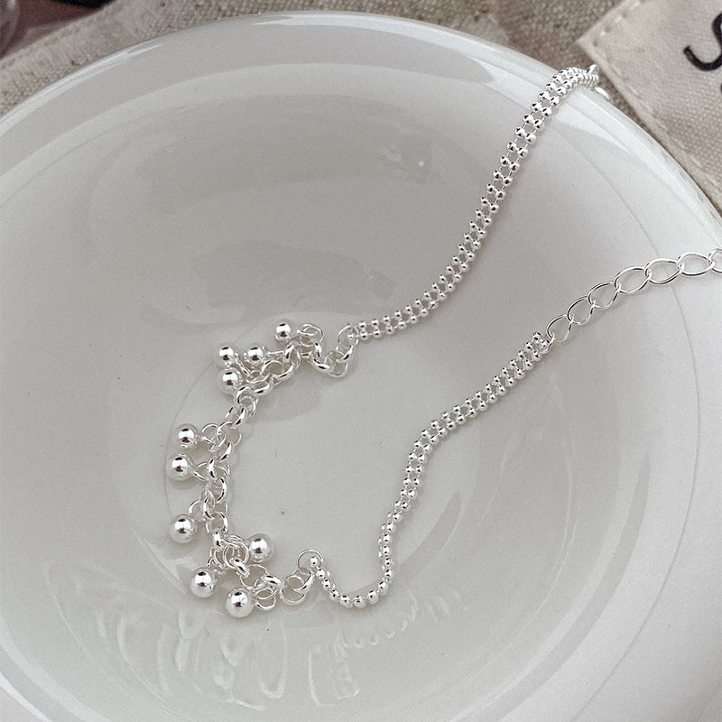 Silbernes Armband mit runden Perlen und Quaste – Bild 4 | LuxeStyle