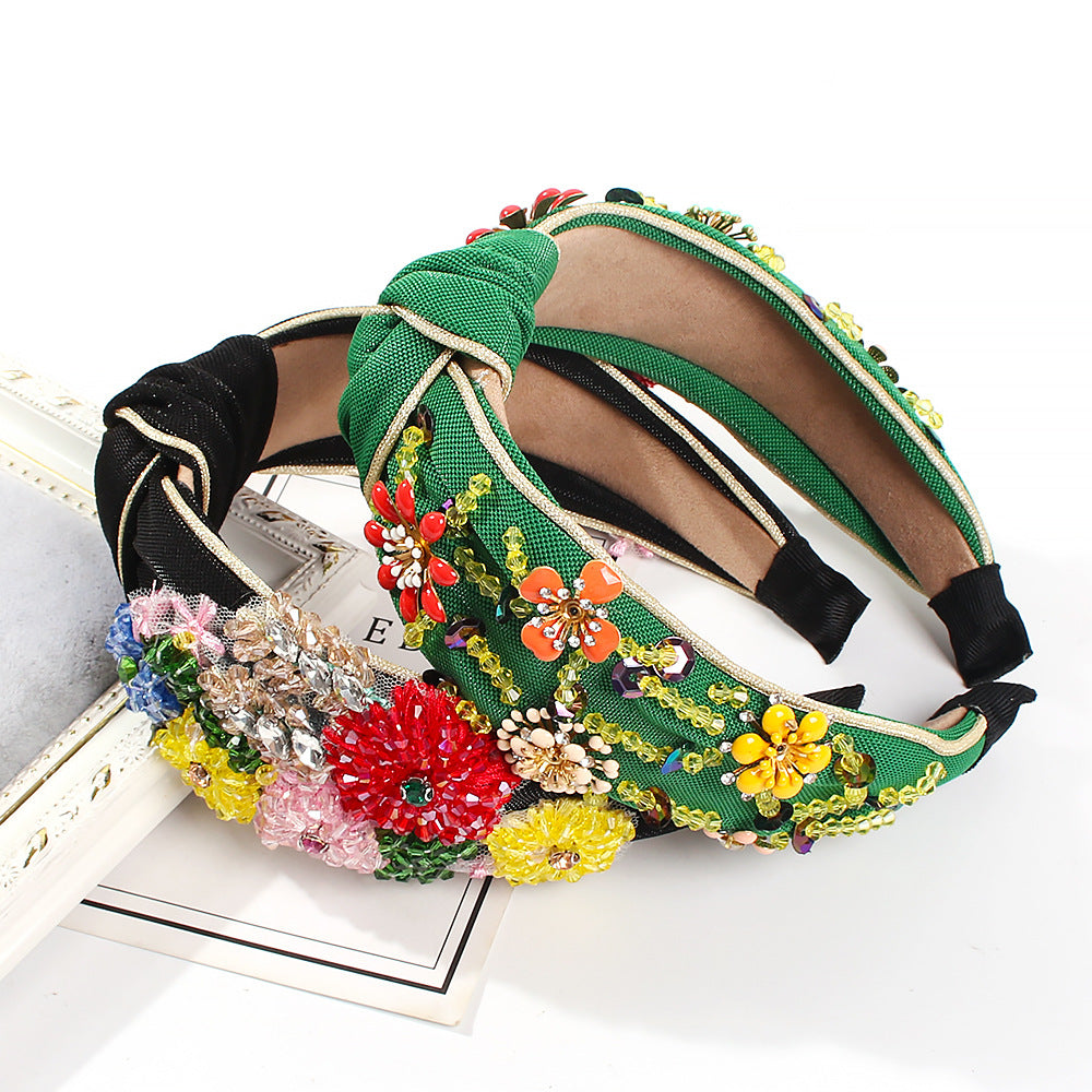 Geflochtenes Haarband mit Blumenmuster