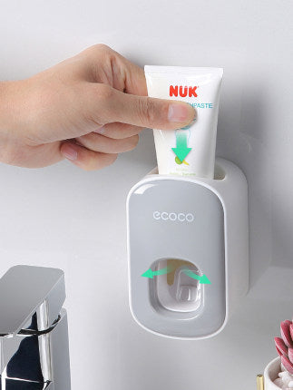 Wandmontierter Zahnpasta-Dispenser