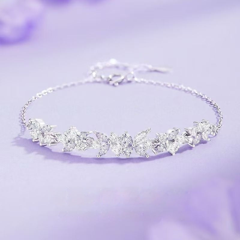 Armband mit Glyzinienblüte aus 999er Sterlingsilber – Bild 1 | LuxeStyle
