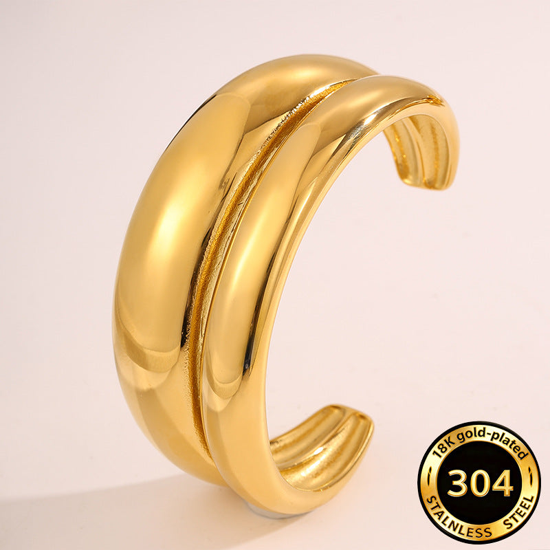 Vergoldetes Doppel-C Armband mit Wellen-Design