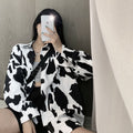 Schwarz-weiss gemusterte Bluse mit Leopardenprint