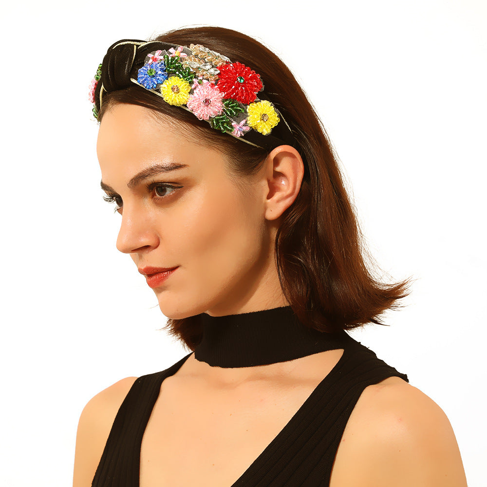 Geflochtenes Haarband mit Blumenmuster