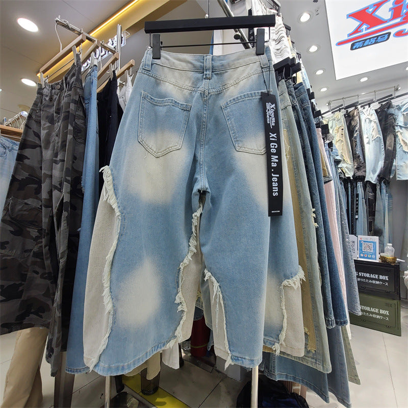 Weite Denim Jeans mit Rohschnitt