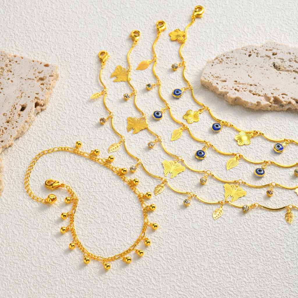 Sommer-Armband «Évil» · Schmetterling & Nazar-Auge, vergoldet