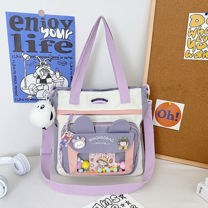 Nylon Rucksack mit Fuzzy-Ball Anhänger – Bild 2 | LuxeStyle