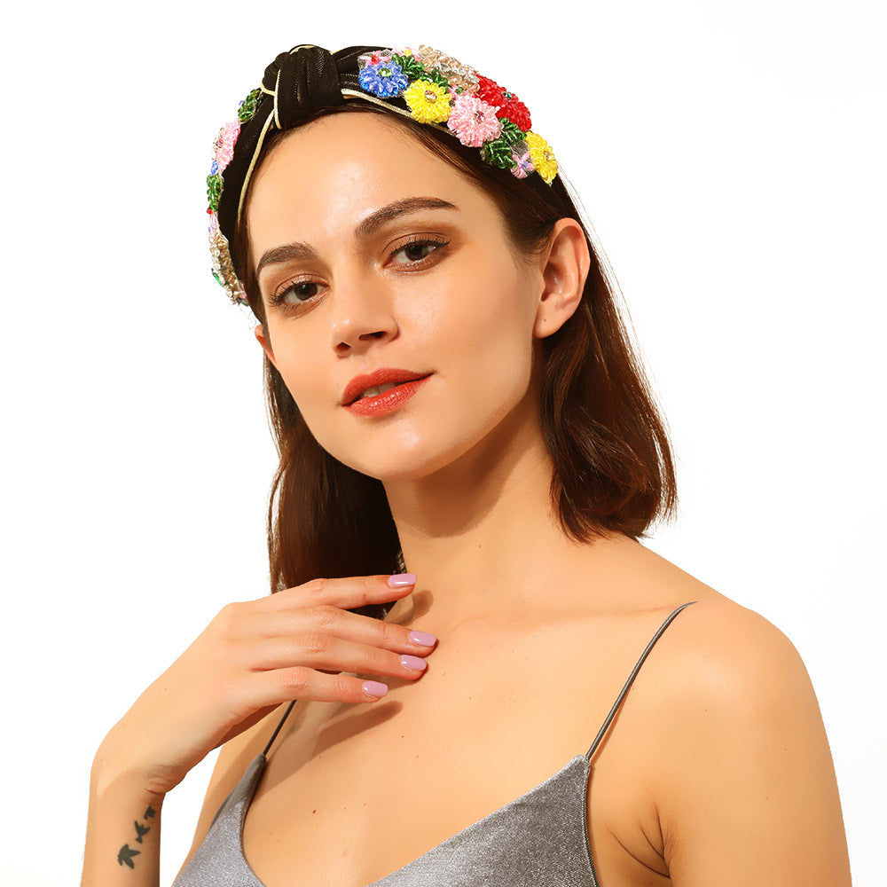 Geflochtenes Haarband mit Blumenmuster