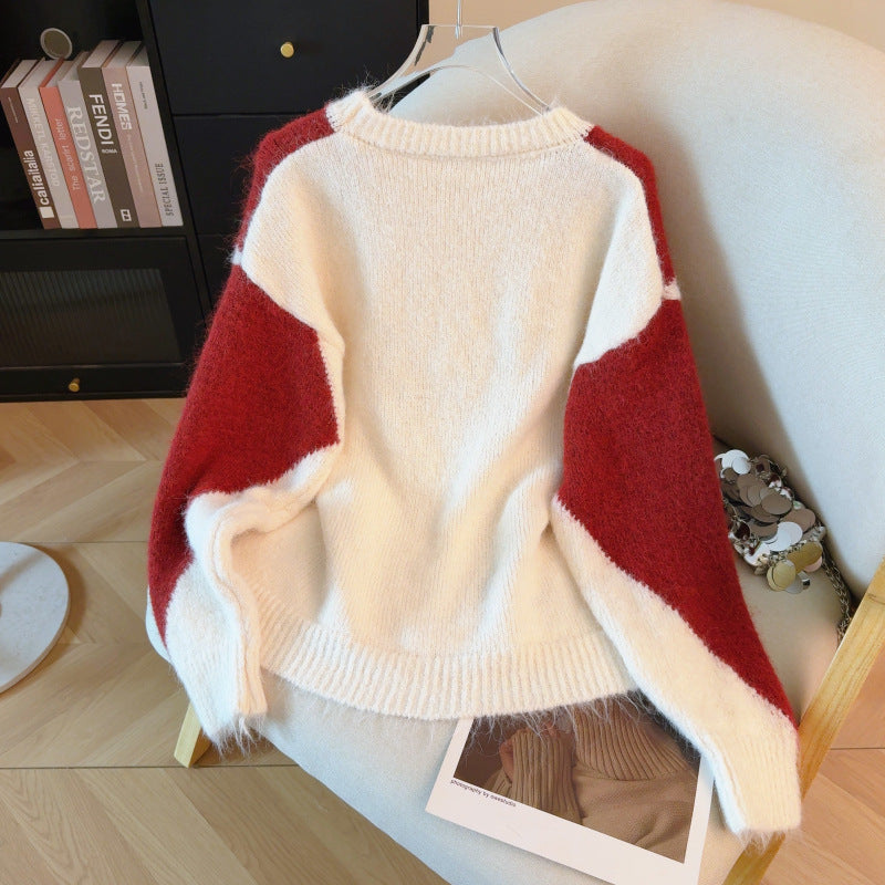 Kontrastfarbener Strickpullover mit Kordelzug
