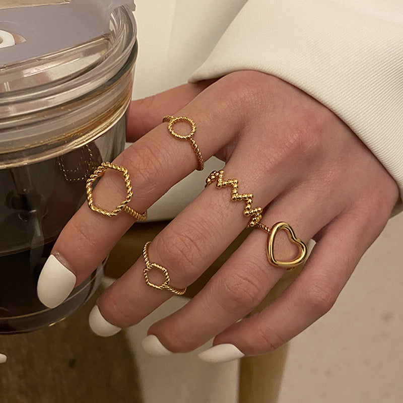 Stapelring-Set Gold mit Herz- und Wellen-Ringen