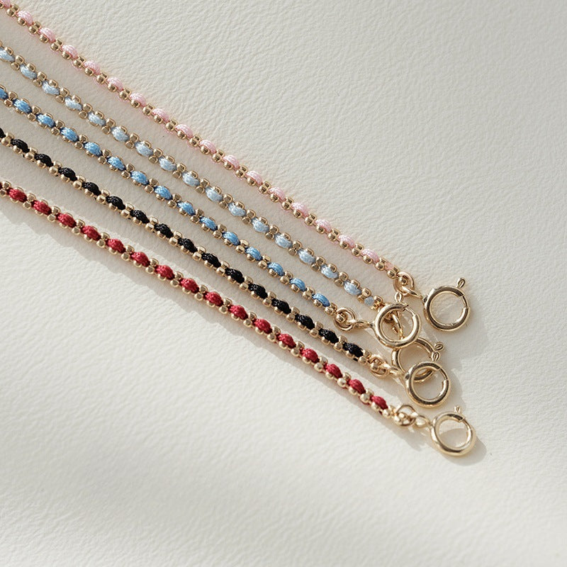 Geflochtenes Armband mit rotem Faden – Bild 2 | LuxeStyle