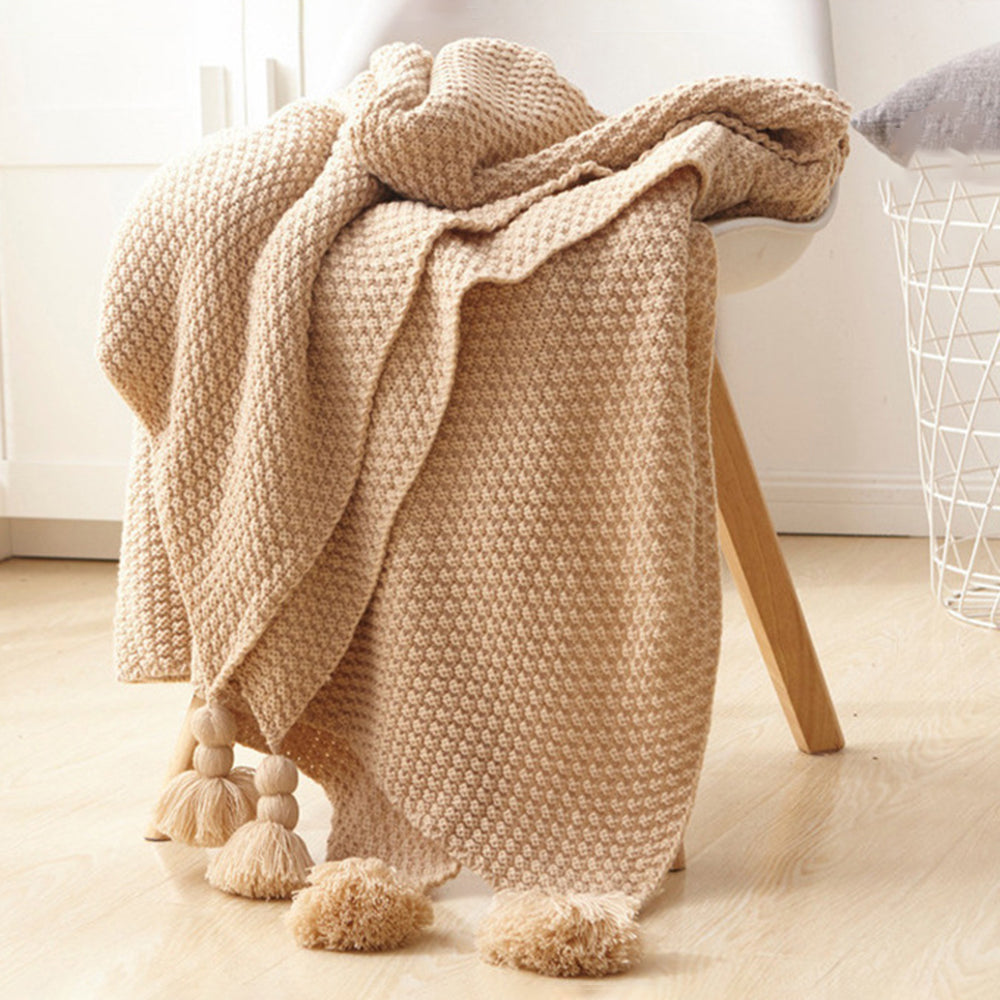 Nordische Strickdecke mit Quasten