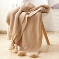 Nordische Strickdecke mit Quasten