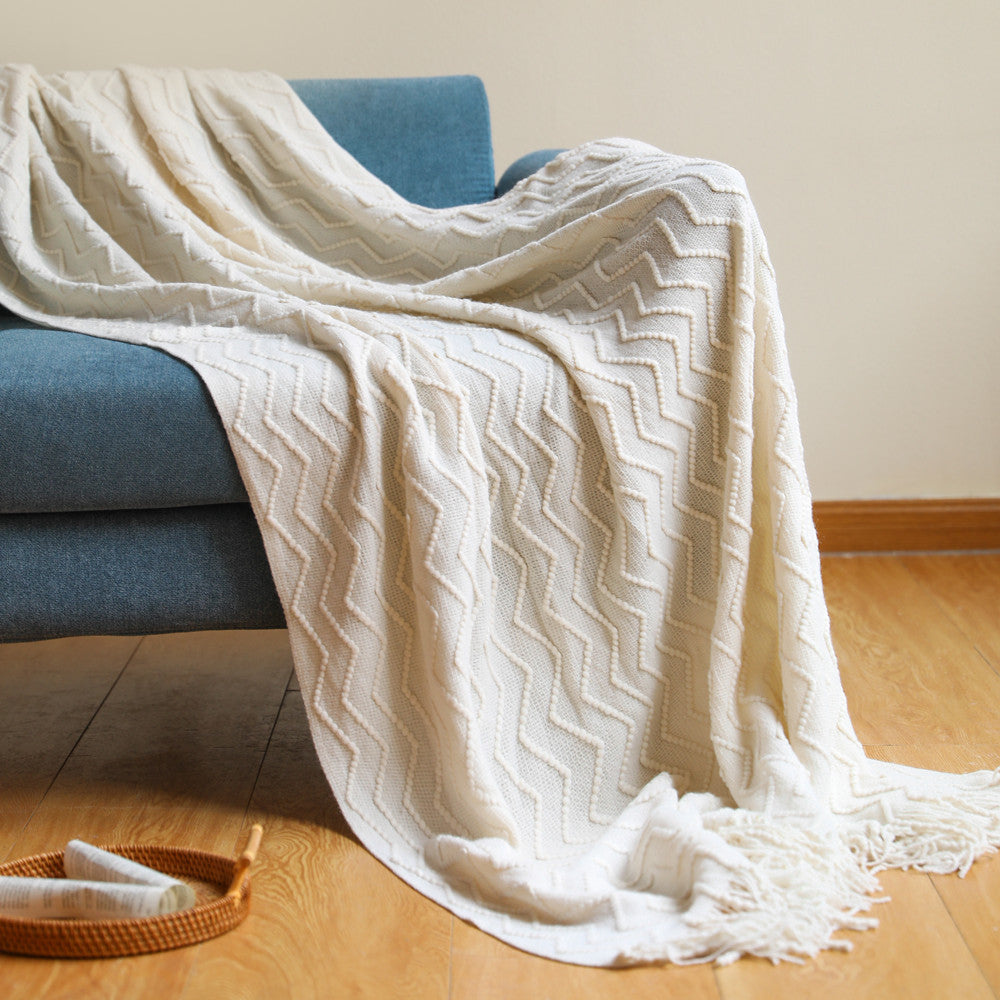 Strickdecke mit Quasten