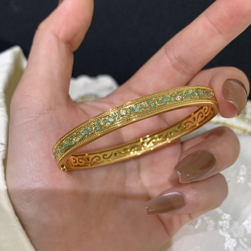 Vintageträger Armreif mit grünem Phönix