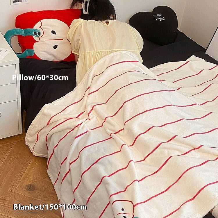 Plaids und Kissen in einem