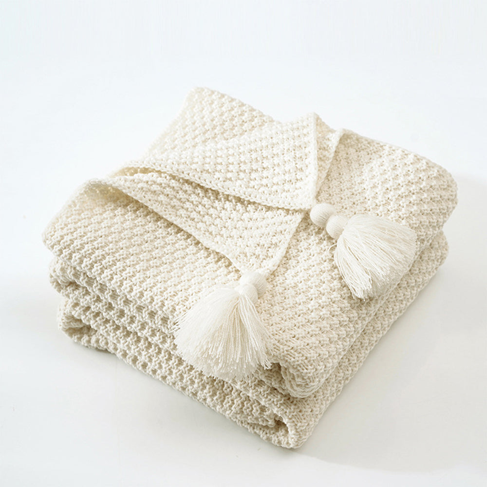 Nordische Strickdecke mit Quasten