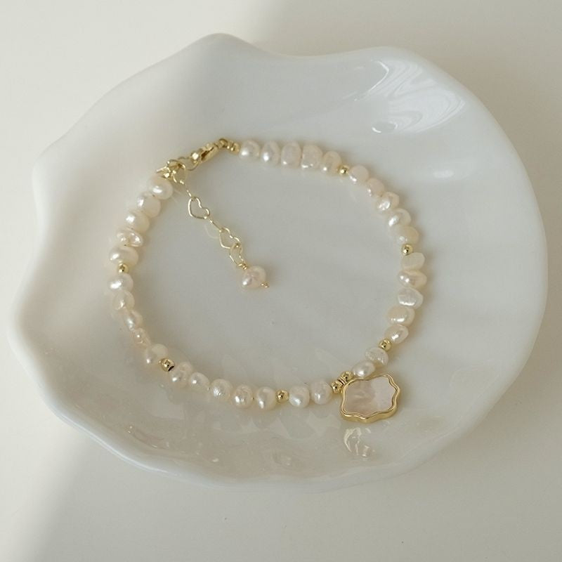 Perlenshalskette mit Muschelarmband