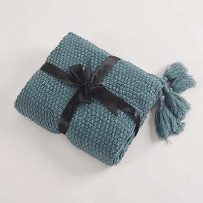 Nordische Strickdecke mit Quasten