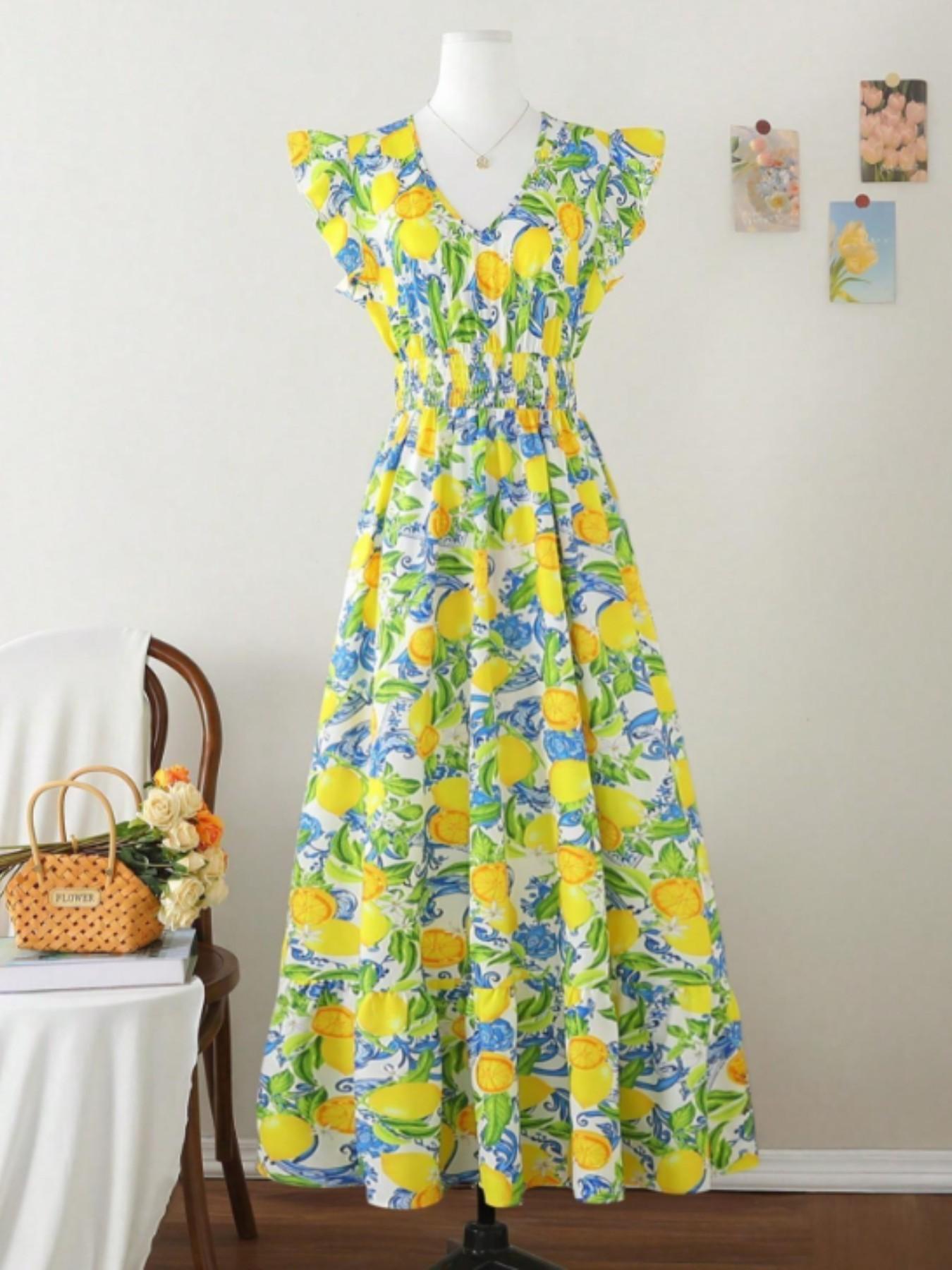 Türkises Kleid mit Zitronenmuster