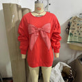 Roter Pullover mit Bogen-Detail