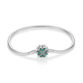 Geflochtenes Herz-Armband, 925-versilbert mit grünem Zirkonia – LuxeStyle