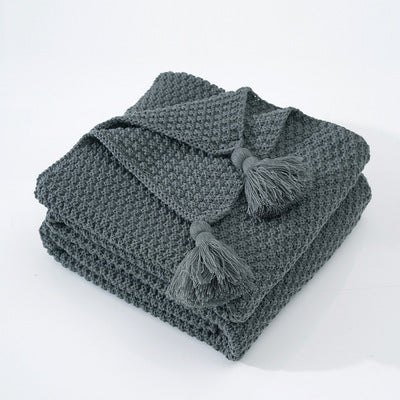 Nordische Strickdecke mit Quasten