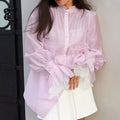 Tailliertes Langarmshirt mit Puffärmeln