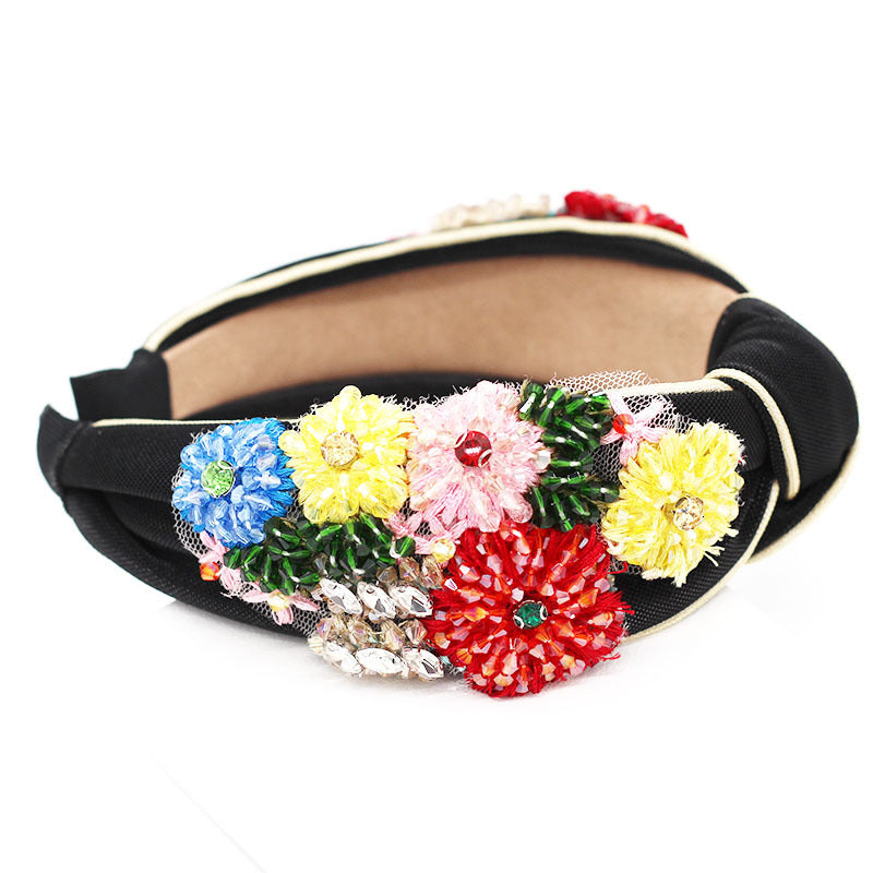 Haarband mit geometrischem Blumenmuster