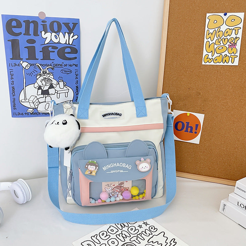 Nylon Rucksack mit Fuzzy-Ball Anhänger – Bild 18 | LuxeStyle
