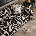 Schwarzer Sofabezug mit Pflanzenmuster | LuxeStyle