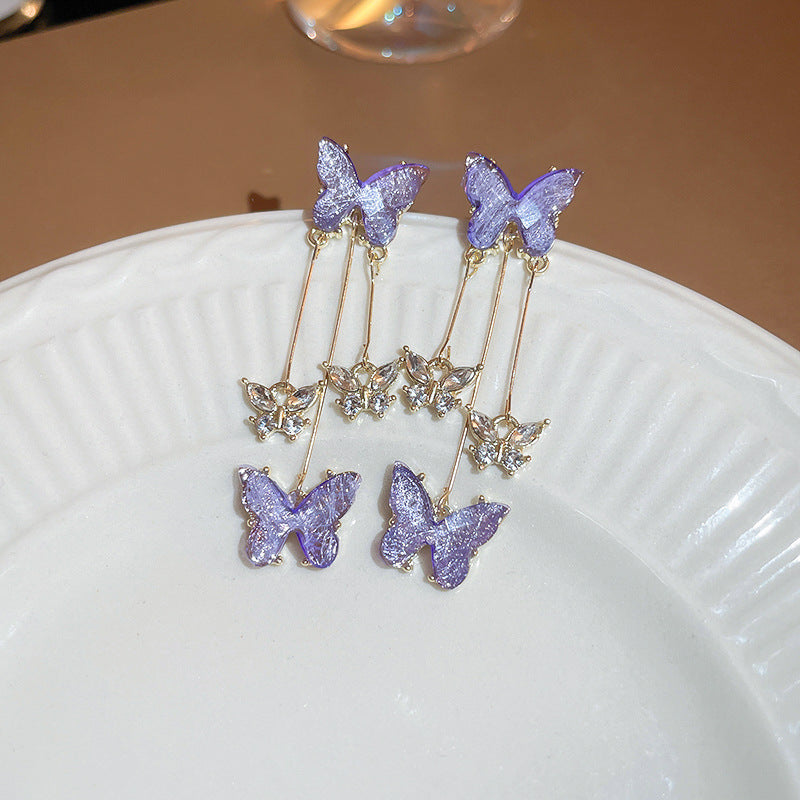 Ohrringe mit lila Strassblüten