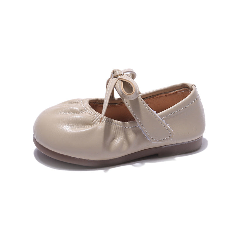 Schwarze Kinderschuhe mit Schleife