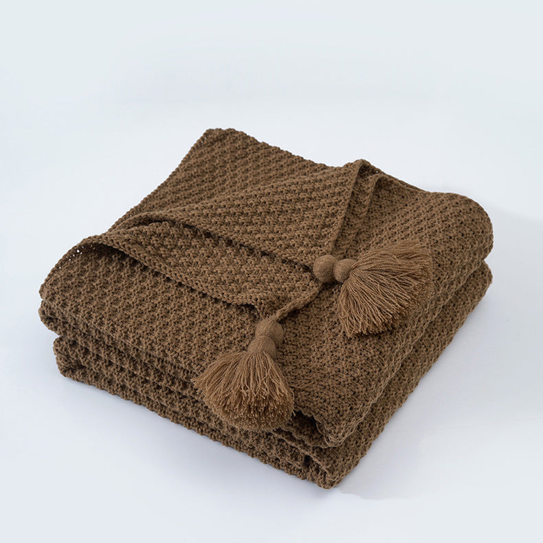 Nordische Strickdecke mit Quasten