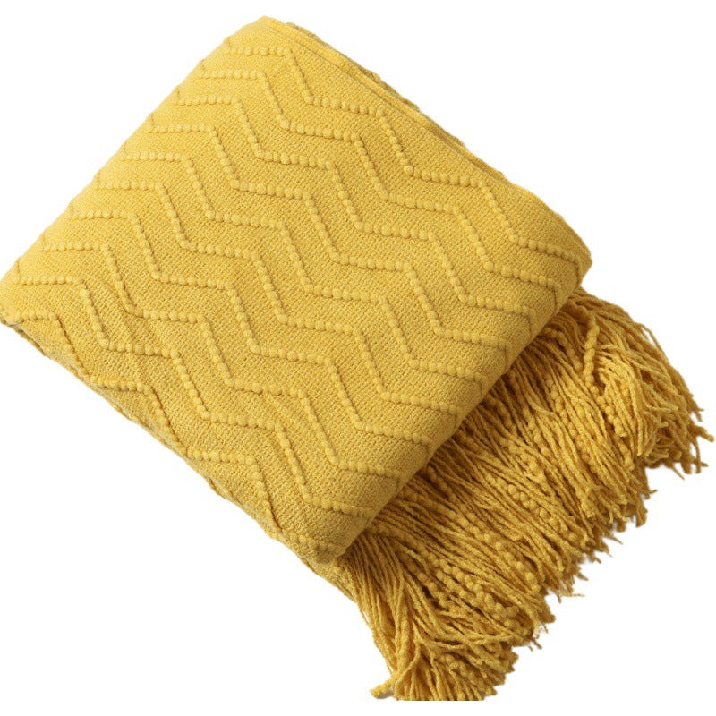 Strickdecke mit Quasten