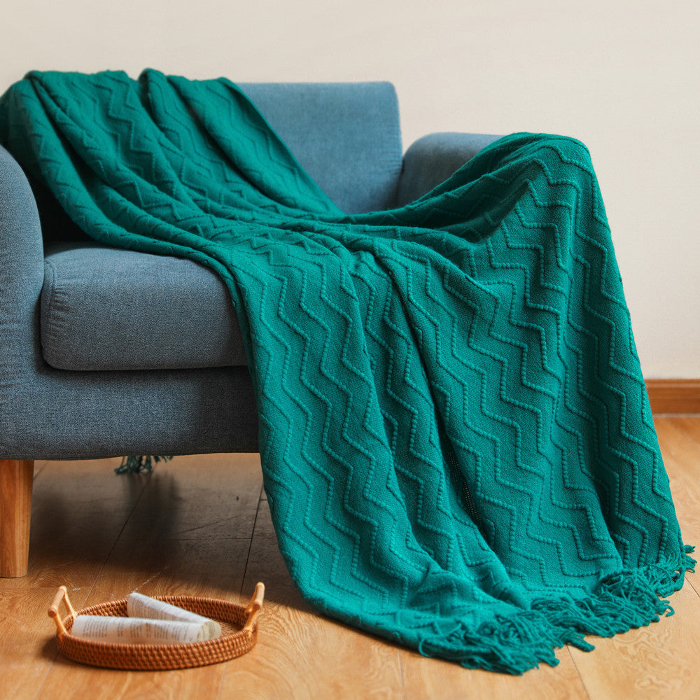 Strickdecke mit Quasten