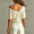 Beige Pullover mit Kreuz-Detail – Bild 1 | LuxeStyle
