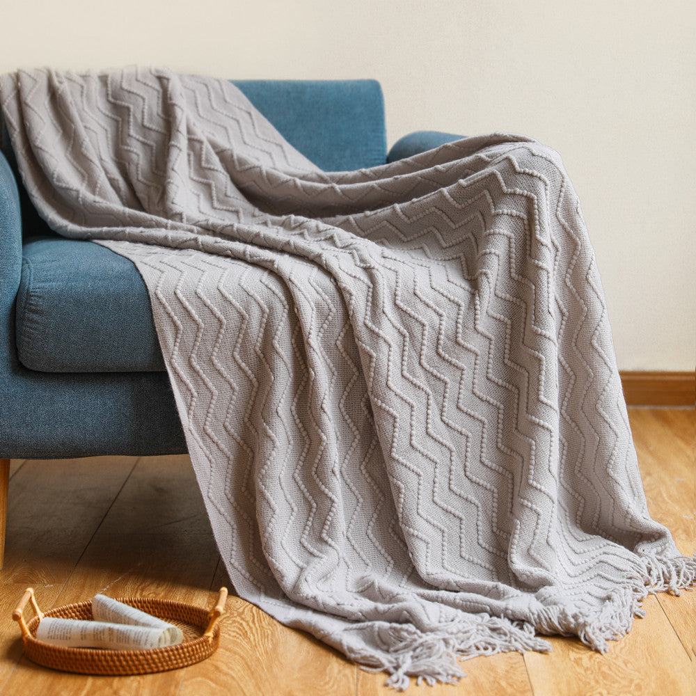 Strickdecke mit Quasten