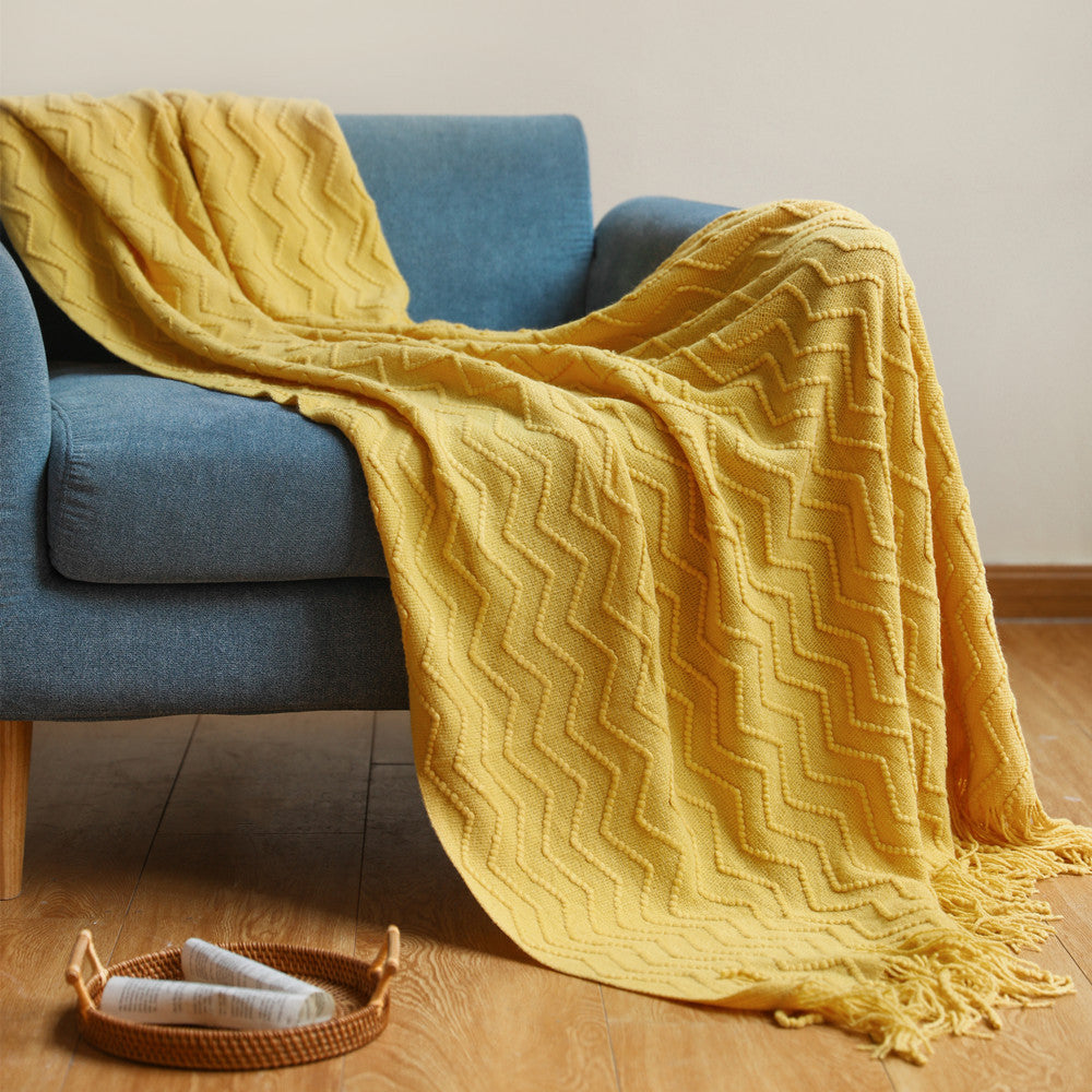 Strickdecke mit Quasten