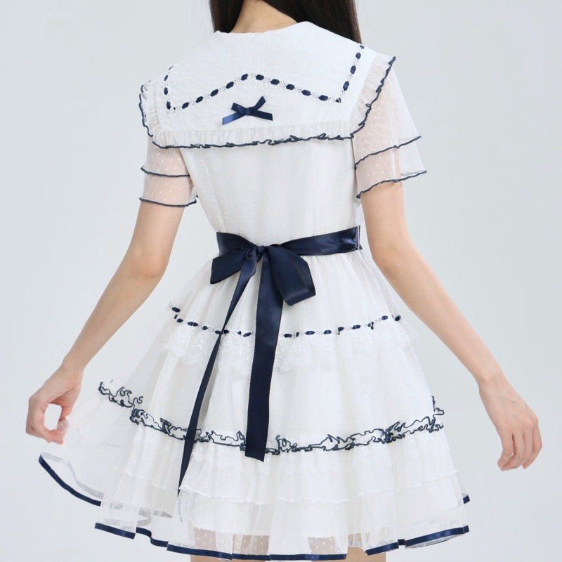 Marineblaues Kleid mit Stickerei und Zierband – Bild 6 | LuxeStyle