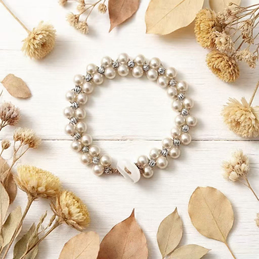 Armband mit grossen und kleinen Imitationsperlen