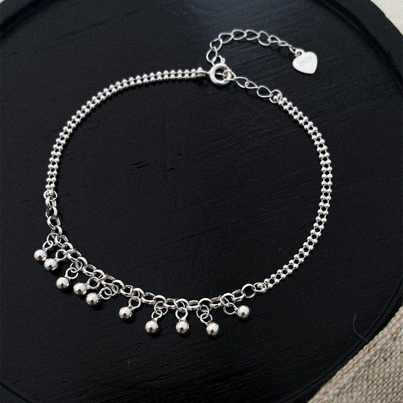Silbernes Armband mit runden Perlen und Quaste – Bild 2 | LuxeStyle