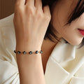 Schwarzes Öl-Tropfen-Armband aus Titanstahl für Damen