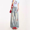 Blaue Jeans mit Cartoon-Stickerei