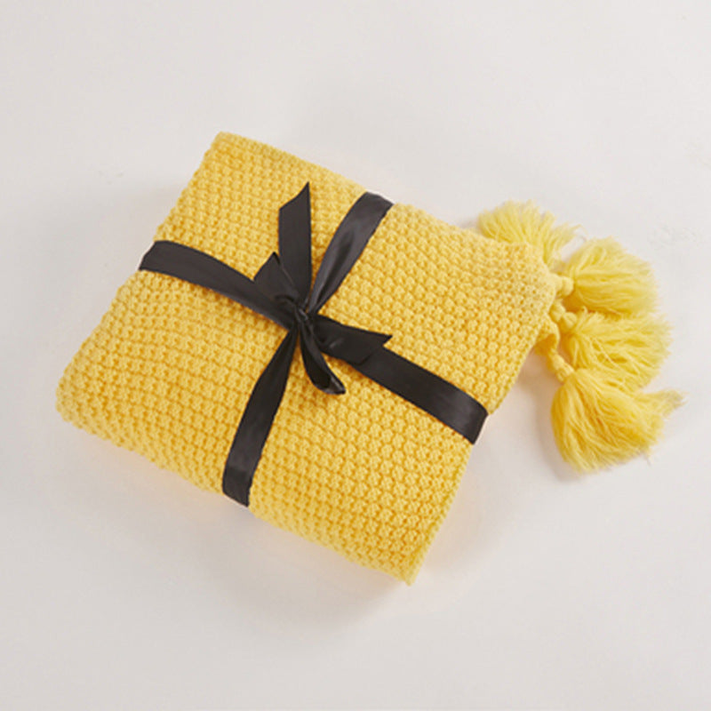 Nordische Strickdecke mit Pompons
