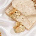Ohrstecker mit hohlem Blumen-Design – Bild 2 | LuxeStyle