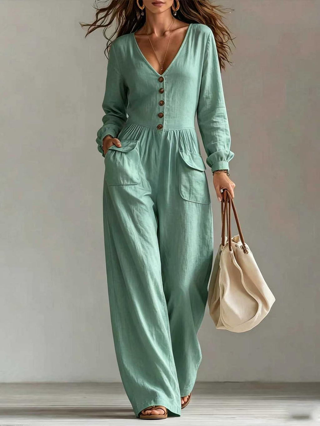 Eleganter Langarm-Jumpsuit mit weitem Bein und V-Ausschnitt