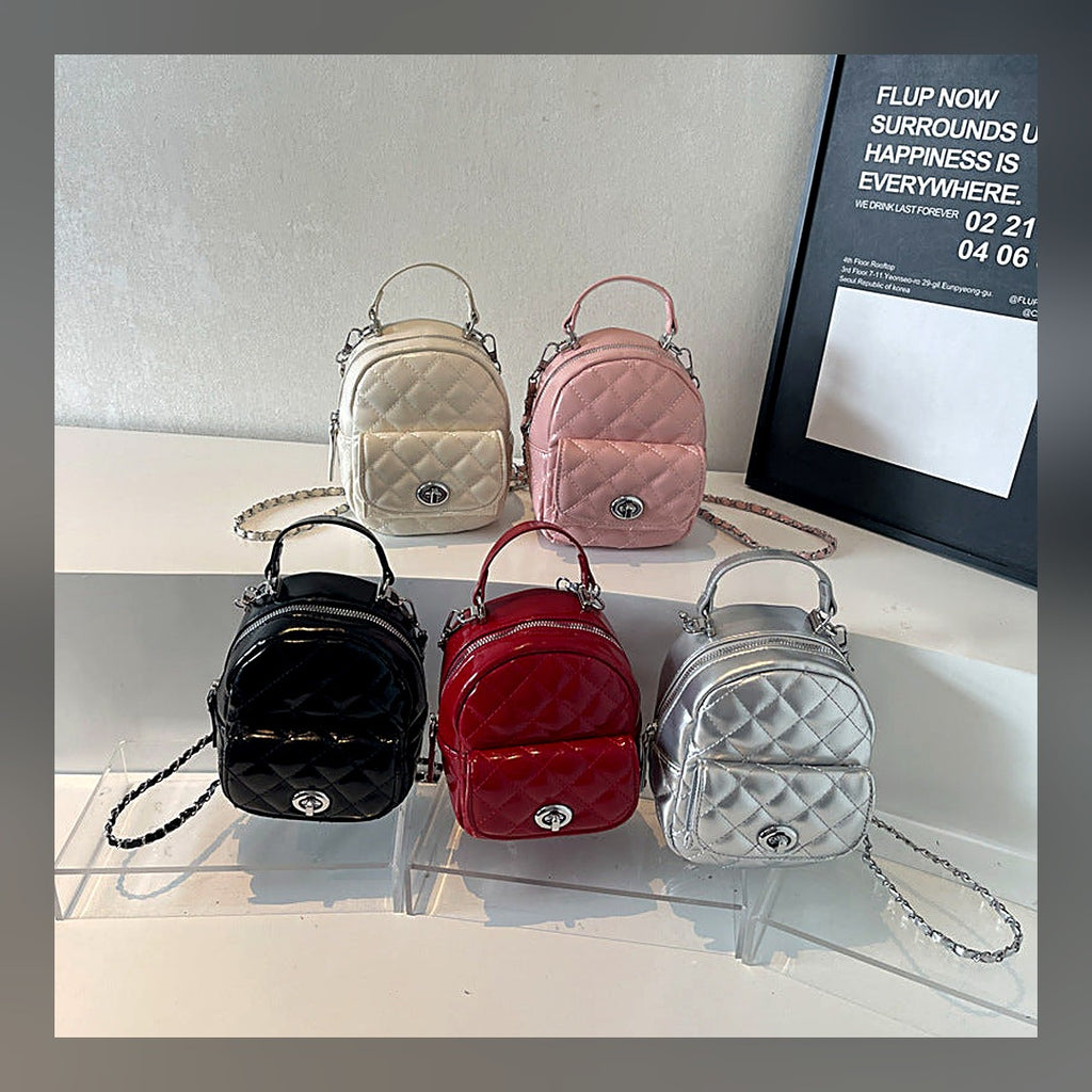 LuxeStyle-Edit · Reise-Rucksack mit Kettengriff – kompakt, vegan-Leder, mehrere Fächer
